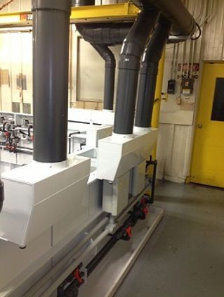 A room with a yellow door and a lot of pipes