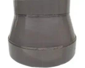 A close up of a gray vase on a white background.