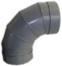 A close up of a pvc elbow on a white background.