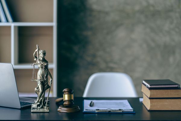 A group of people are sitting in a room clapping their hands.