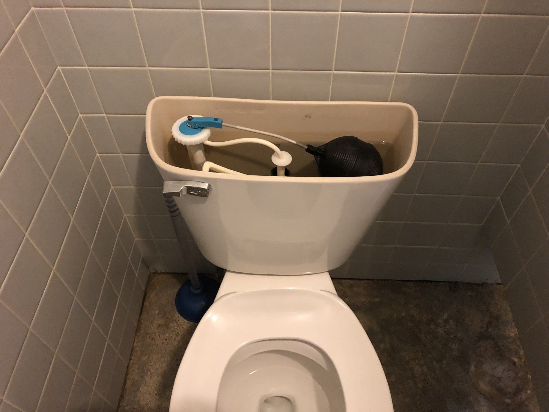 the cover removed from the back of the toilet