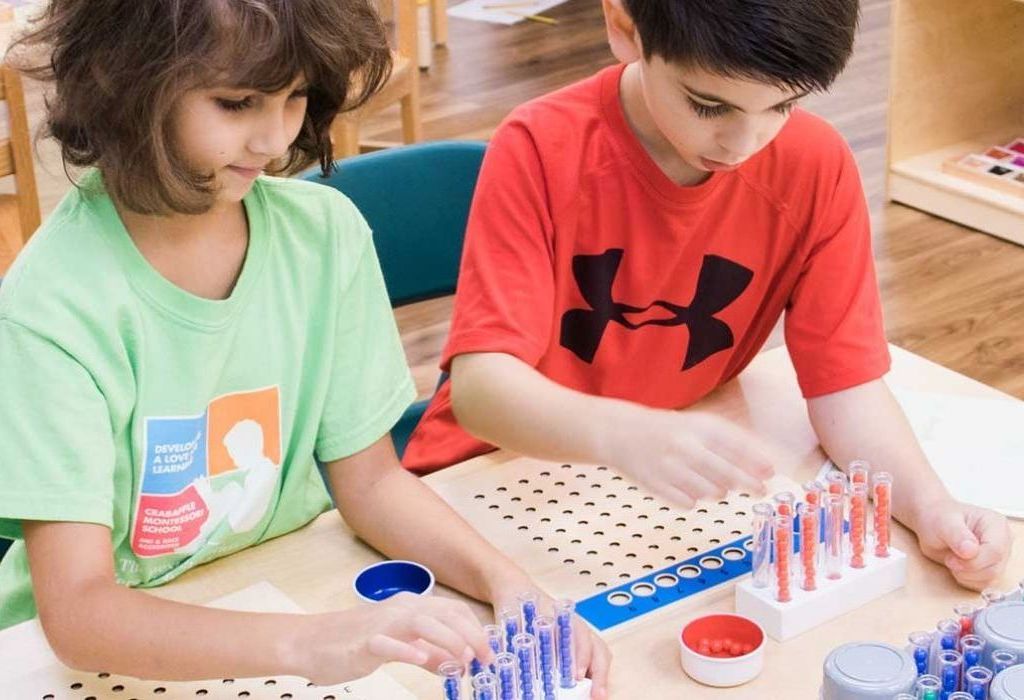 Children working with Montessori Math materials