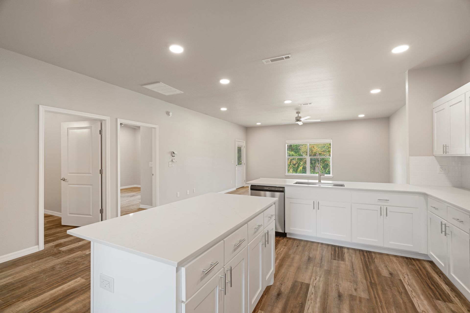 There is a large island in the middle of the kitchen.