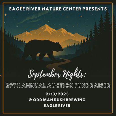 A button for the eagle river nature center with a moose and a bear on it.