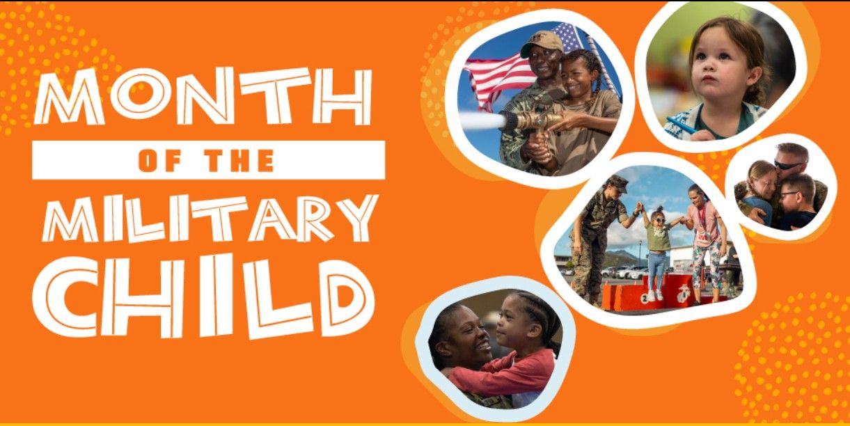 A man is standing on top of a mountain next to a boat.