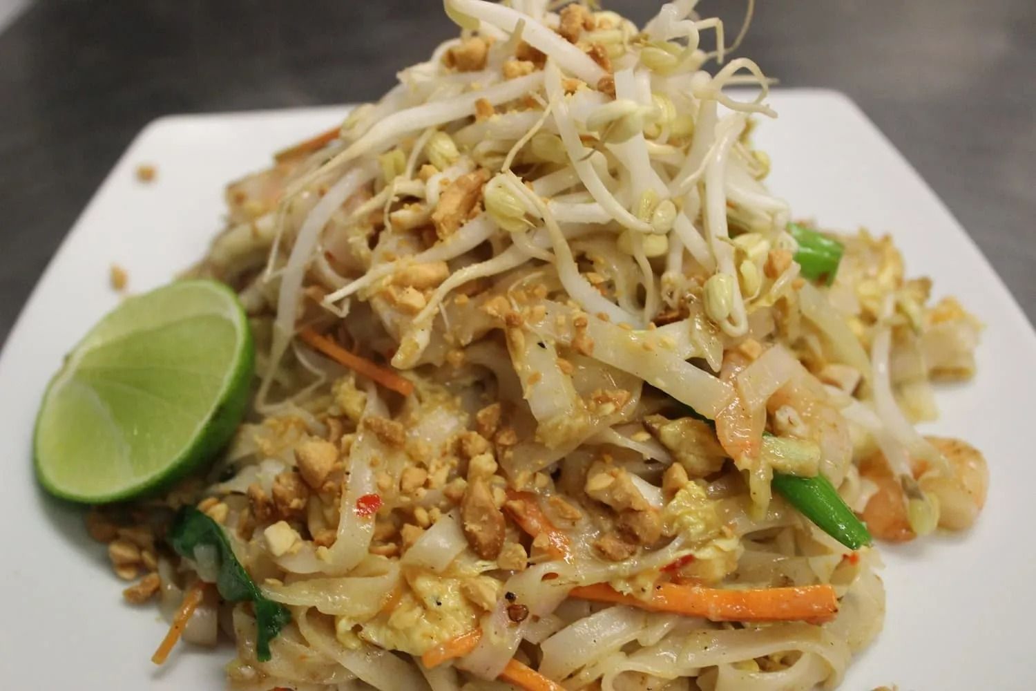 Pad Thai Noodles Topped With Bean Sprouts, Peanuts, and a Lime Wedge — L'il Buddha Asian Cuisine in Salamander Bay, NSW