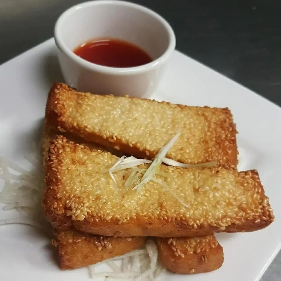 Fried Sesame Toast with Dipping Sauce on A White Plate — L'il Buddha Asian Cuisine in Salamander Bay, NSW