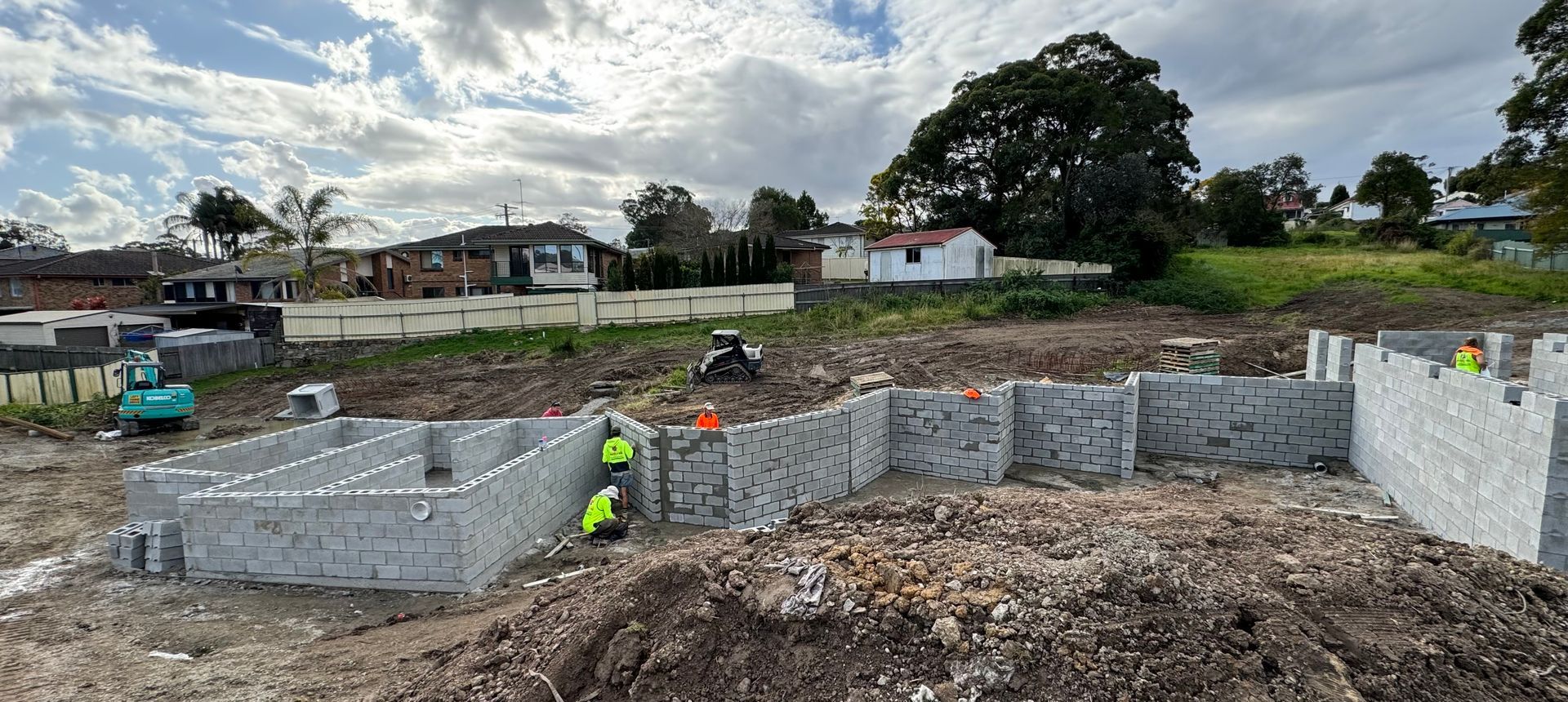 A group of construction workers are working on a construction site.
