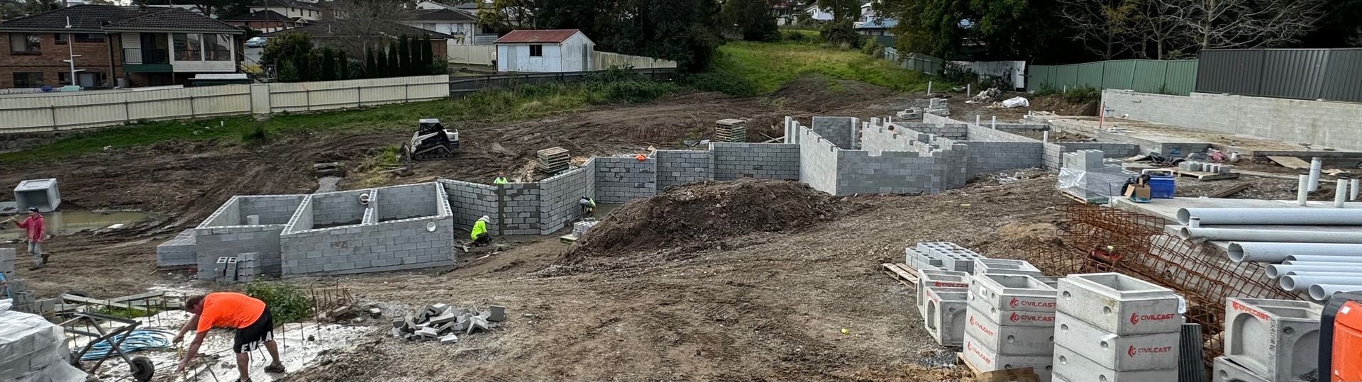 A group of construction workers are working on a construction site.