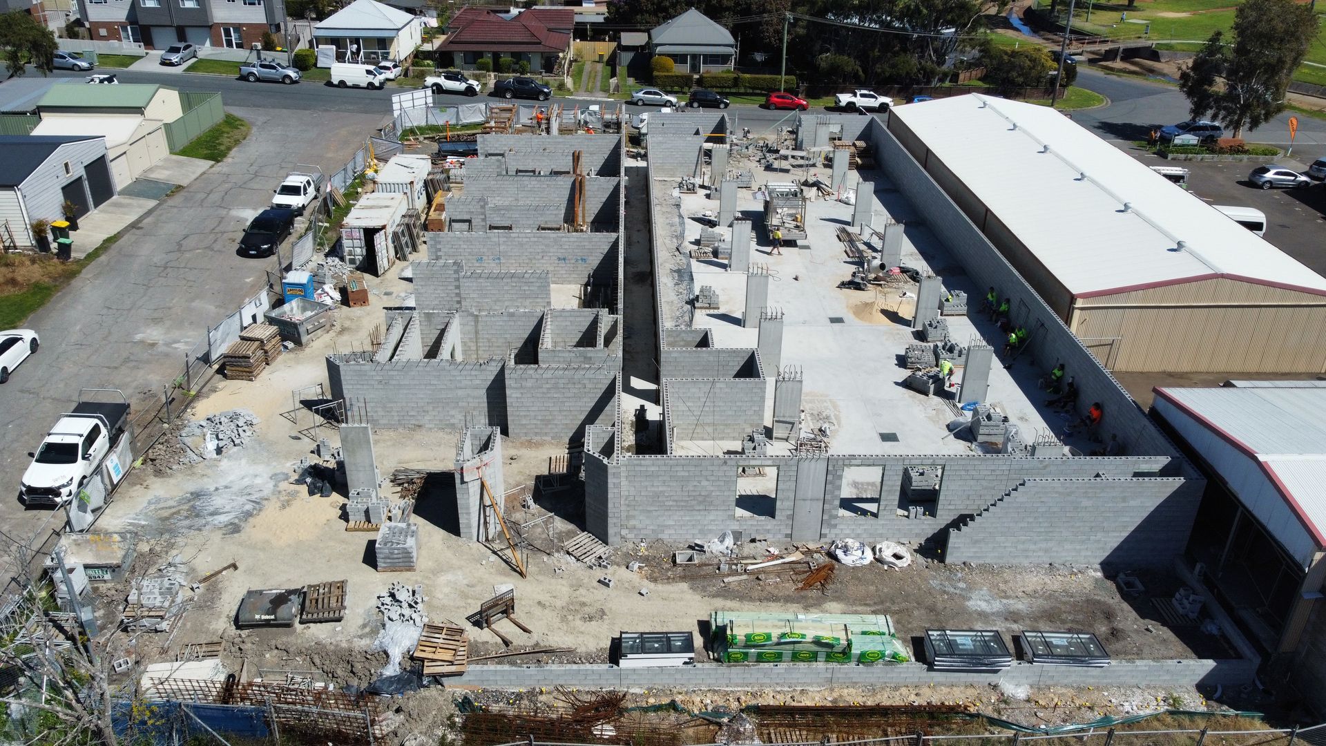 An aerial view of a building under construction in a city