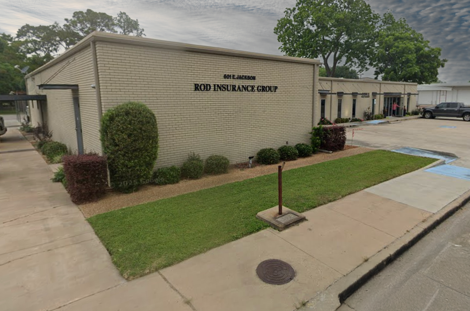 A brick building with the sign 