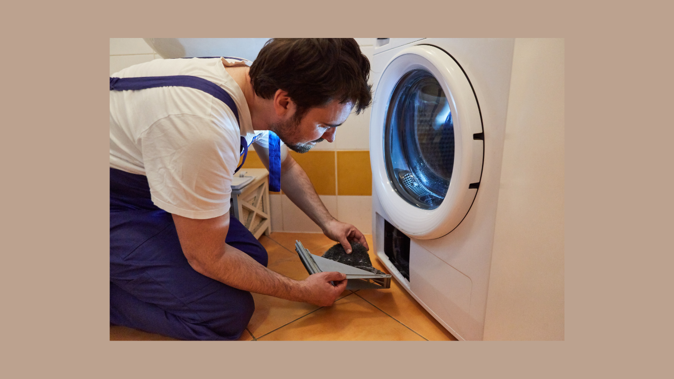 A man is fixing a washing machine in a bathroom.