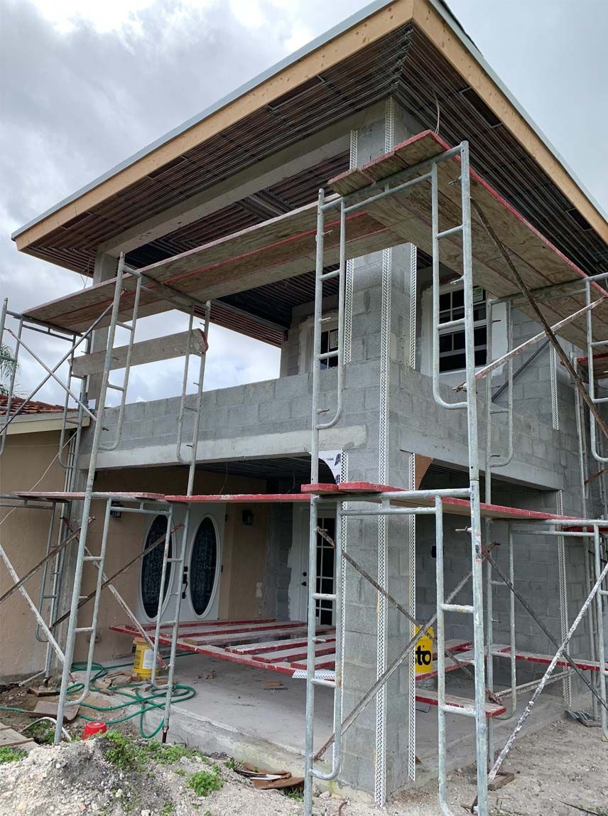 A house is being built with scaffolding around it.