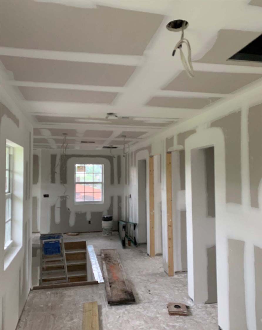 A hallway in a house that is being remodeled