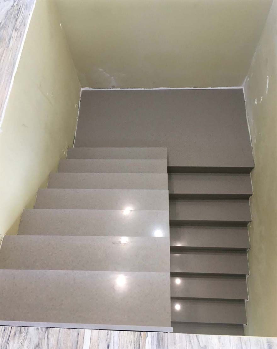 A set of stairs leading up to the second floor of a building.