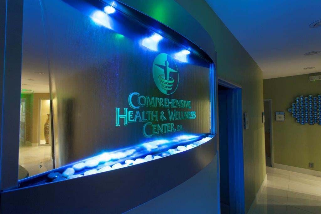 A hallway with a sign that says compassionate health and wellness center