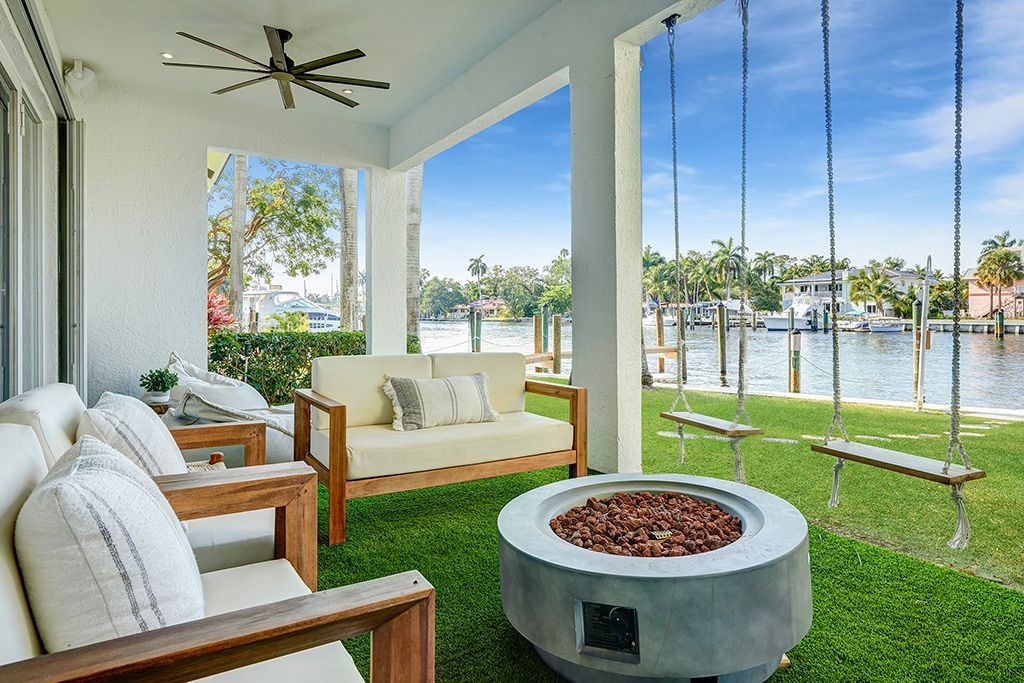 There is a fire pit in the middle of the lawn.