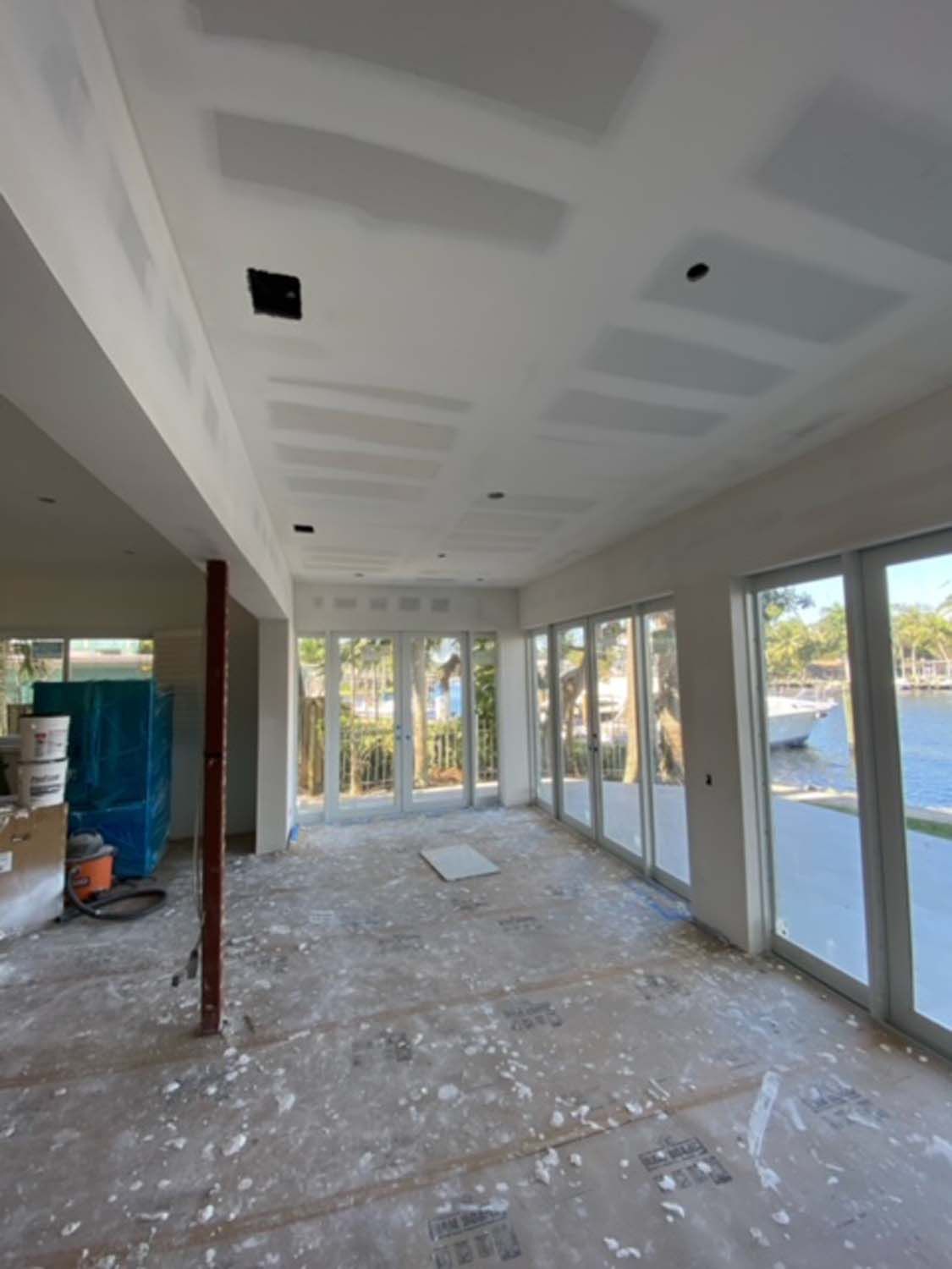 A large empty room with a lot of windows