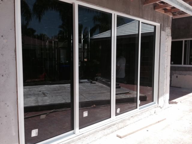 A house under construction with a lot of windows