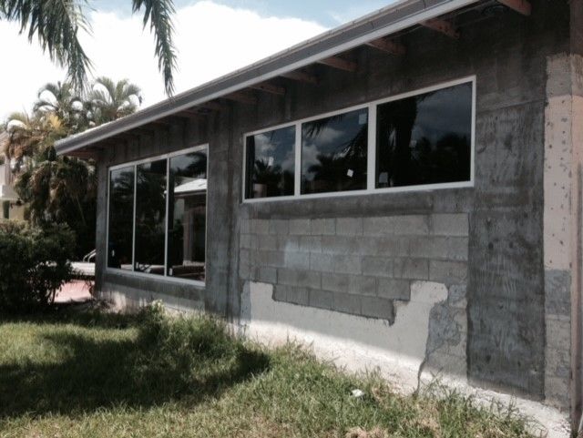 A house with a lot of windows is being built