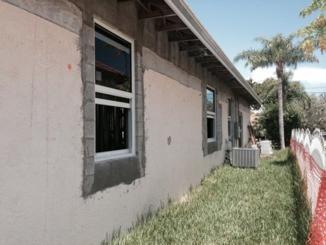 A house with a lot of windows is being built