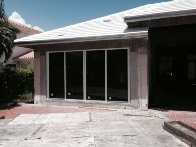 A house with a lot of windows and a white roof