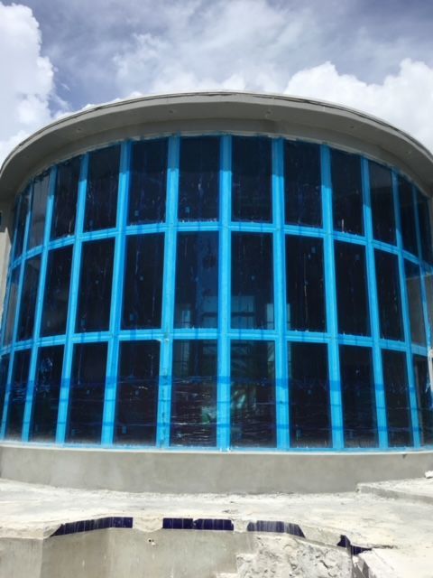 A large building with a lot of blue windows