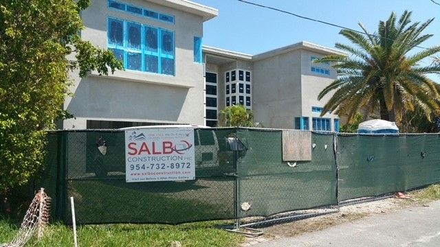 A building under construction with a sign that says salb construction