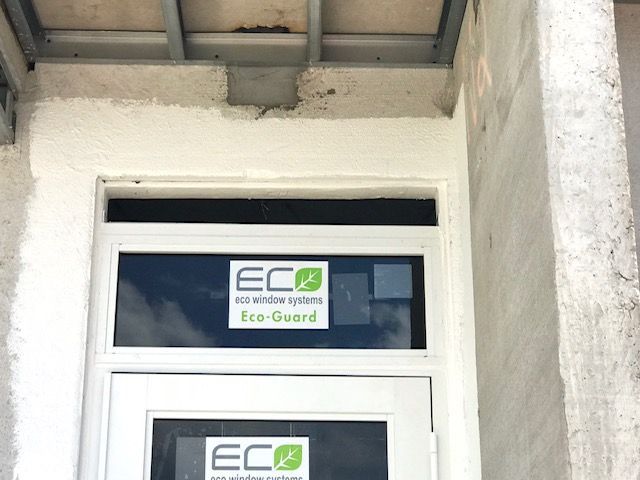 A door with a sticker on it that says eco guard on it.