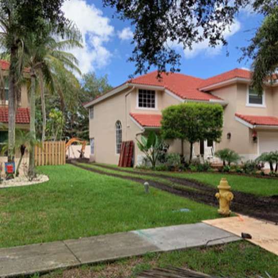 A large house with a fire hydrant in front of it