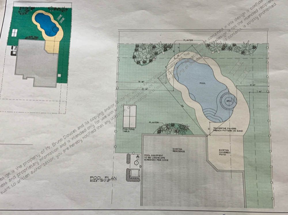 A drawing of a house with a large pool