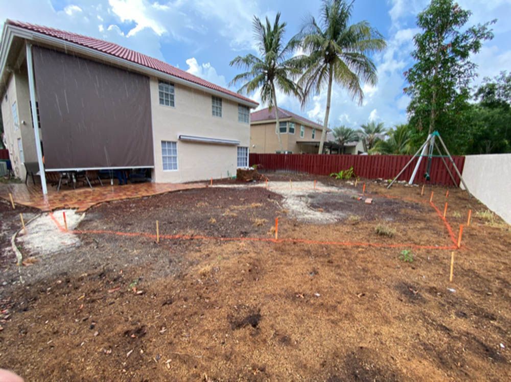 A large house with a lot of dirt in front of it.