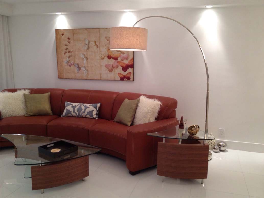 A living room with a couch and a lamp