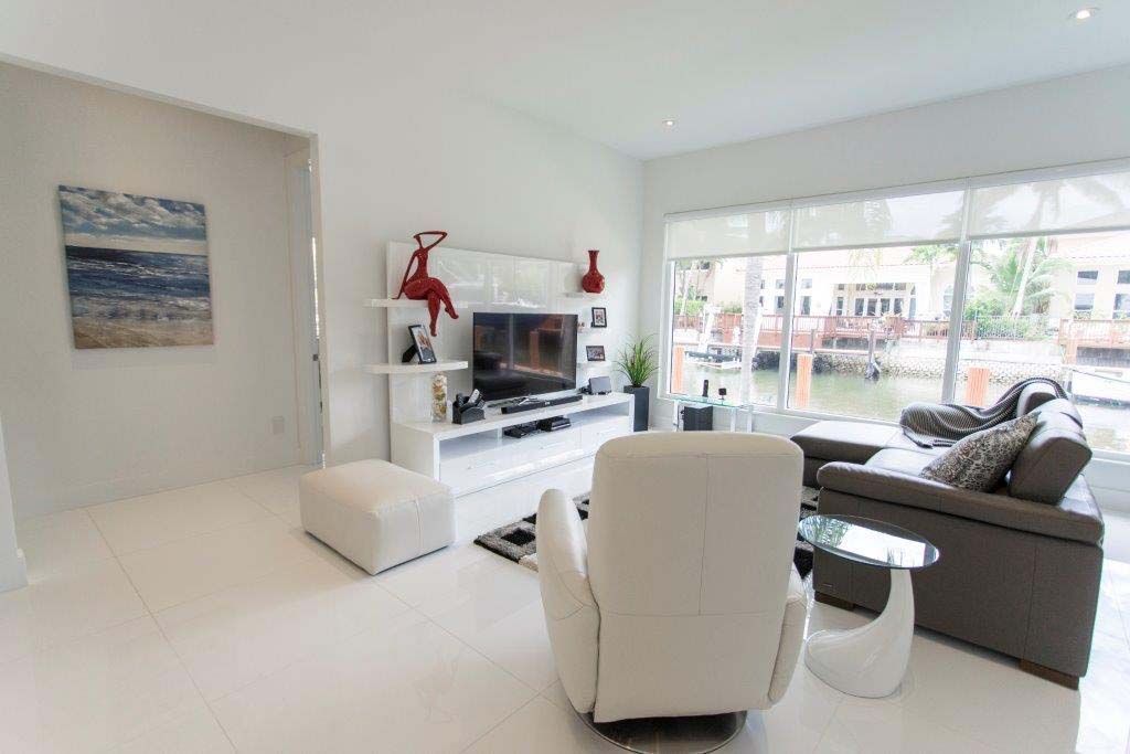 A living room filled with furniture and a television.