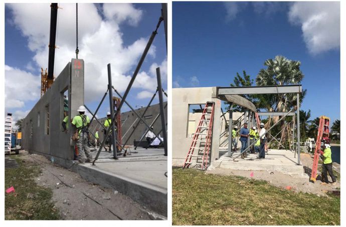 A group of construction workers are working on a building.