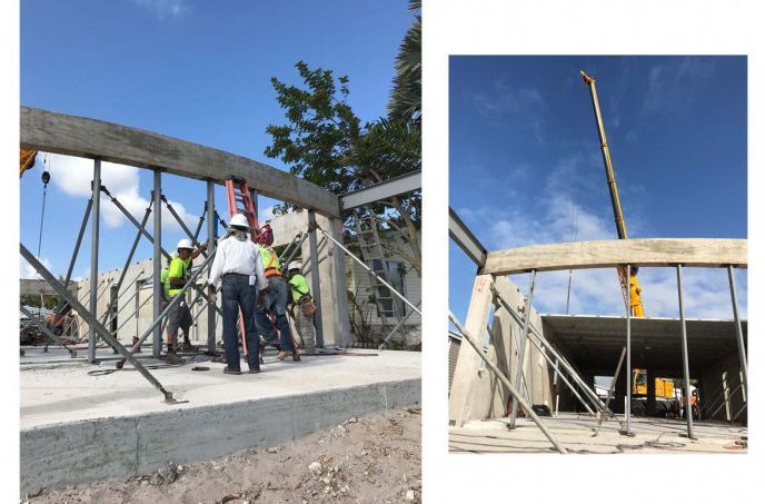 A group of construction workers are working on a building
