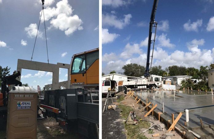 A crane is lifting a piece of concrete on a construction site.