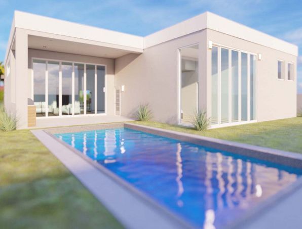 A white house with a swimming pool in front of it.