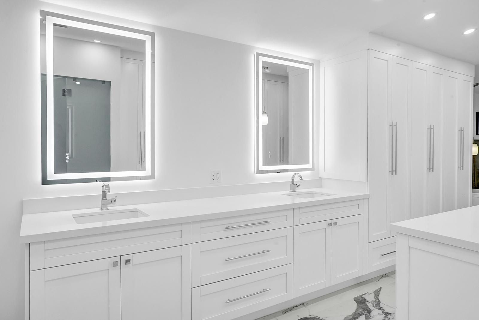 A bathroom with two sinks and two mirrors.