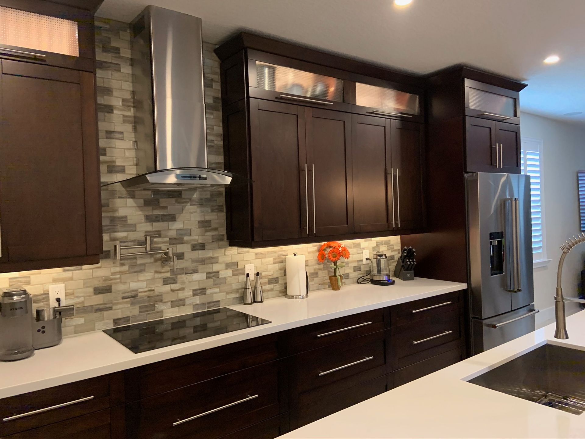 A kitchen with stainless steel appliances and wooden cabinets
