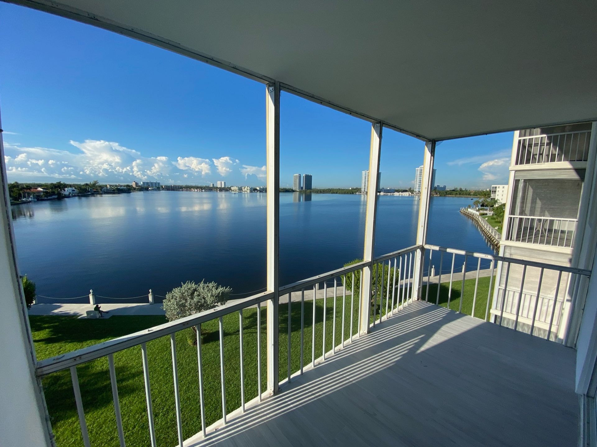 A balcony with a view of a body of water