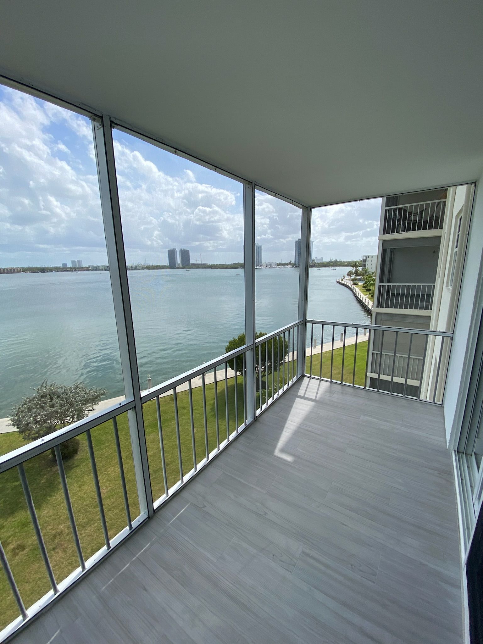A balcony with a view of a body of water.