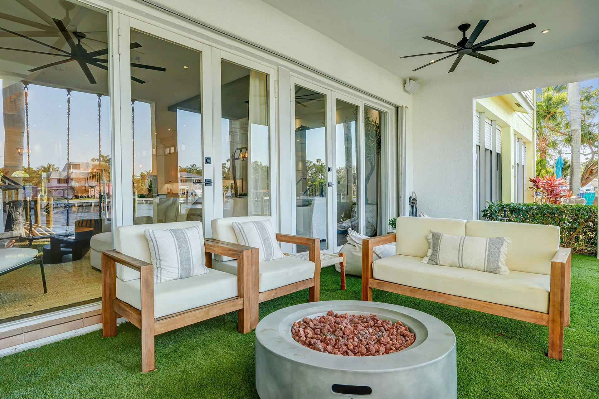 There is a fire pit in the middle of the patio.