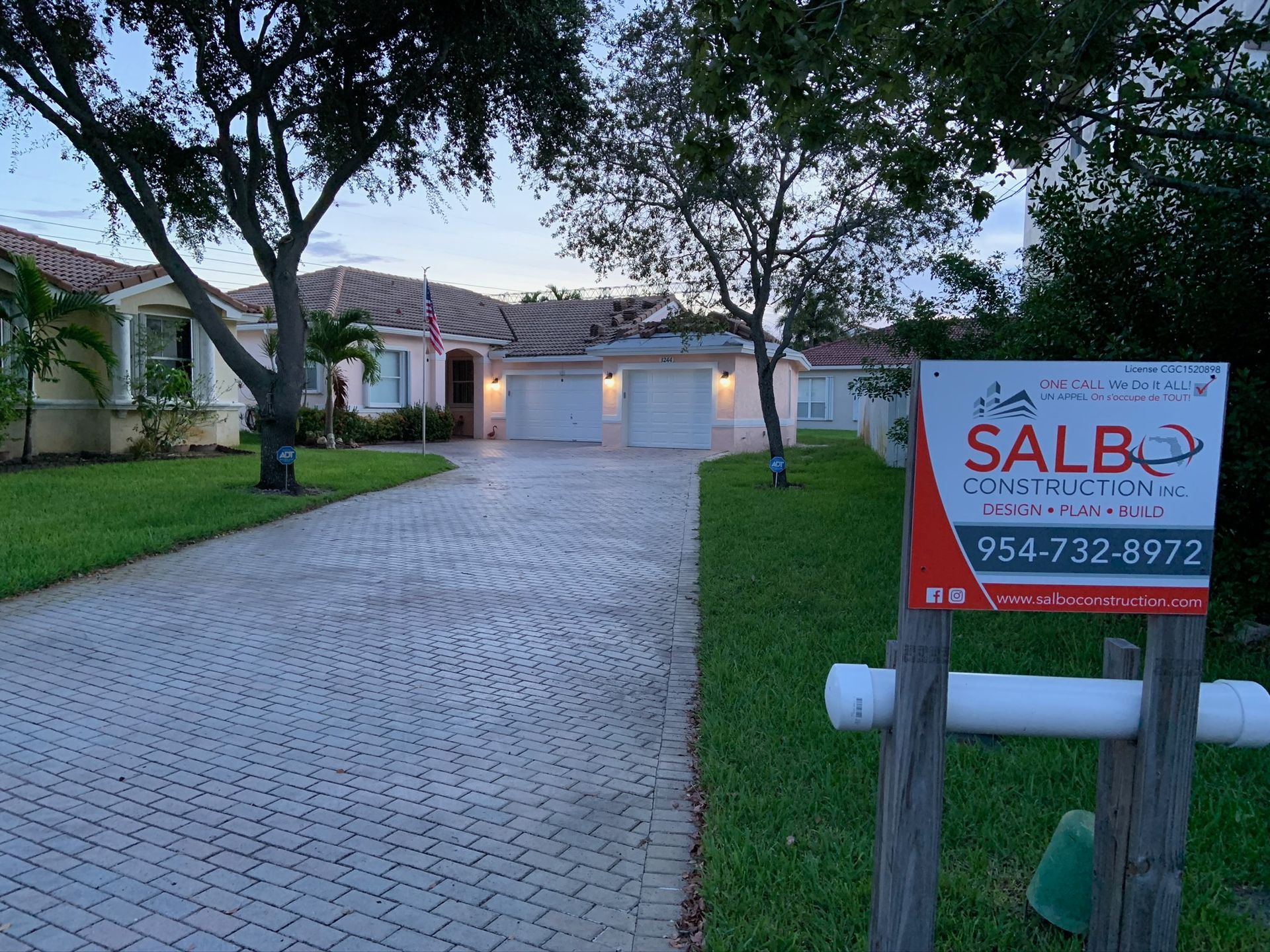 A sign in front of a house says salb construction
