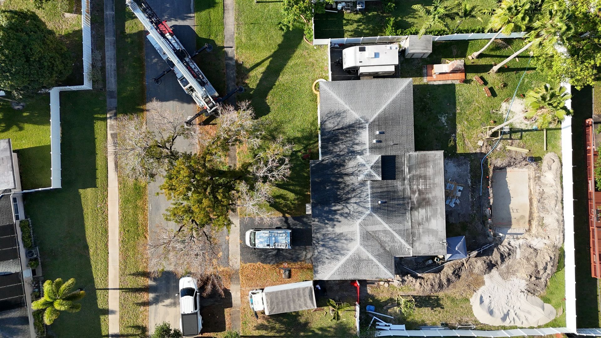 An aerial view of a house being built in a residential area.