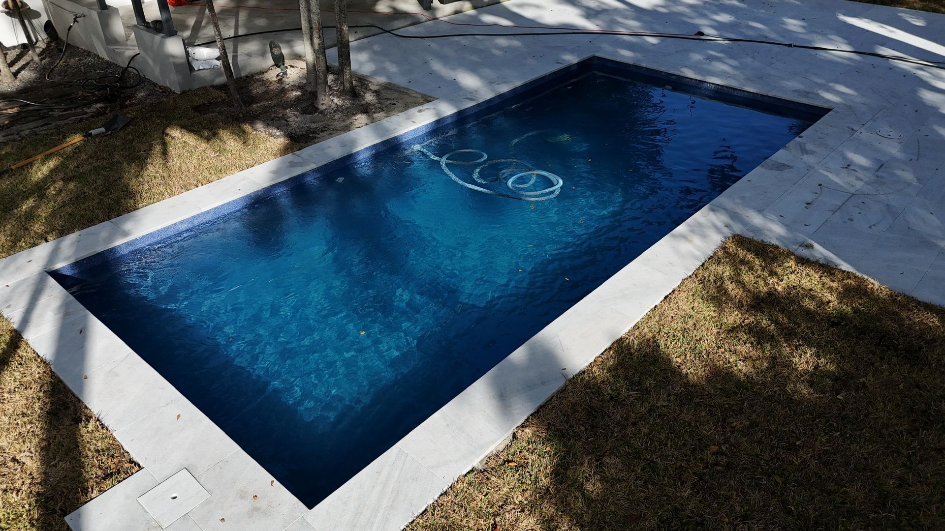 A large swimming pool with the word rio written in the water