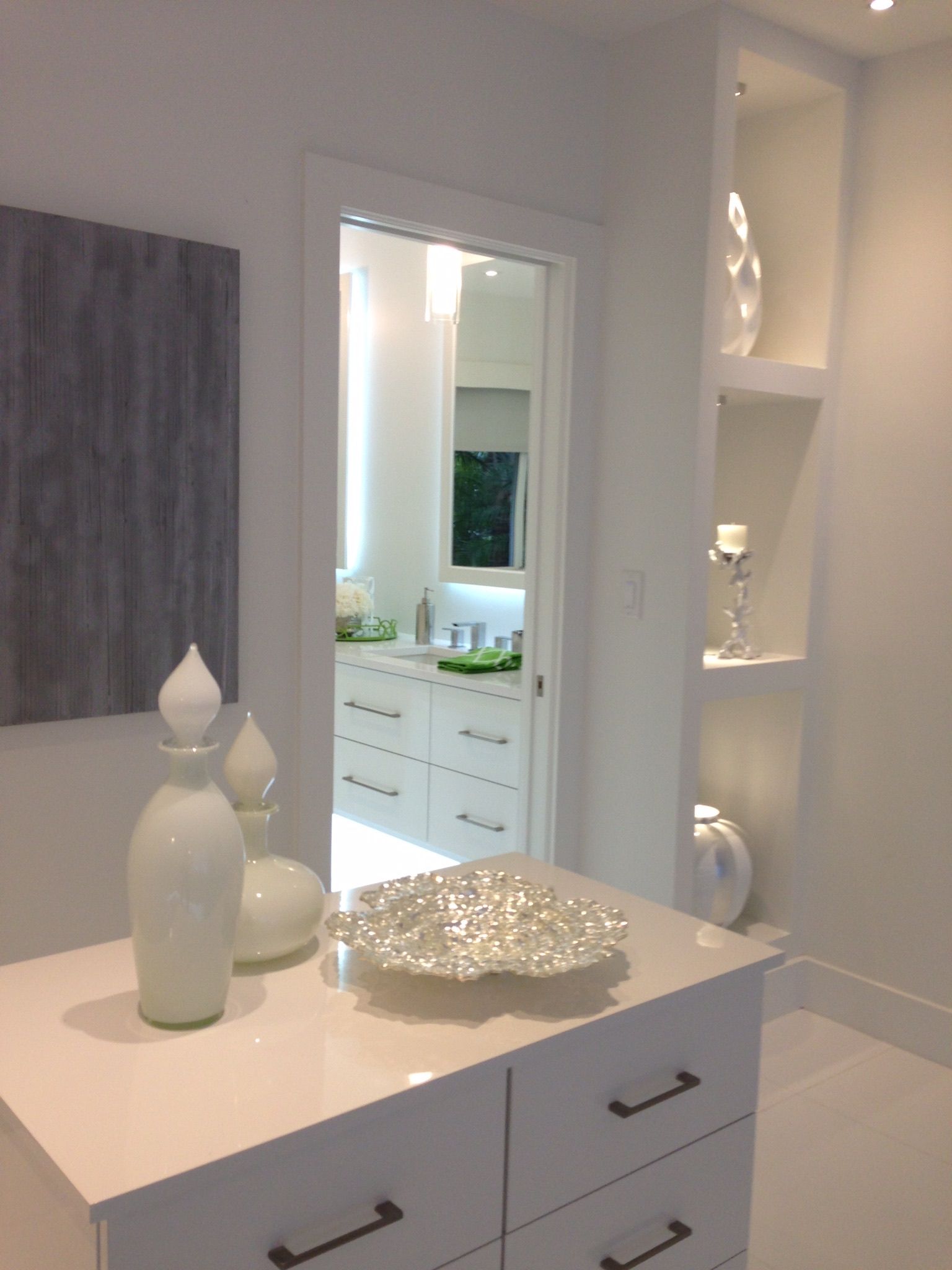 A dresser in a room with a bowl on top of it