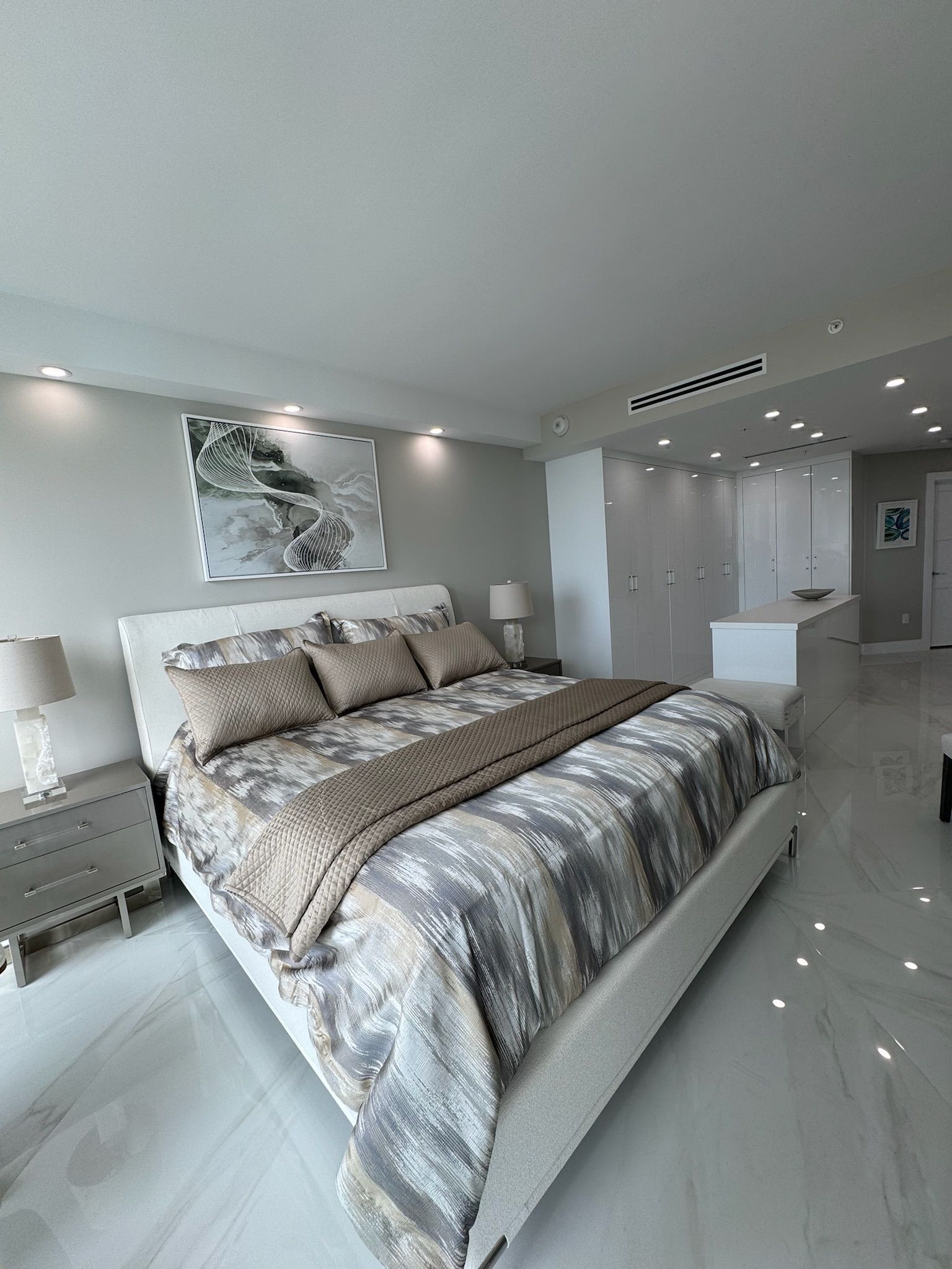 There is a large bed in the middle of the room.