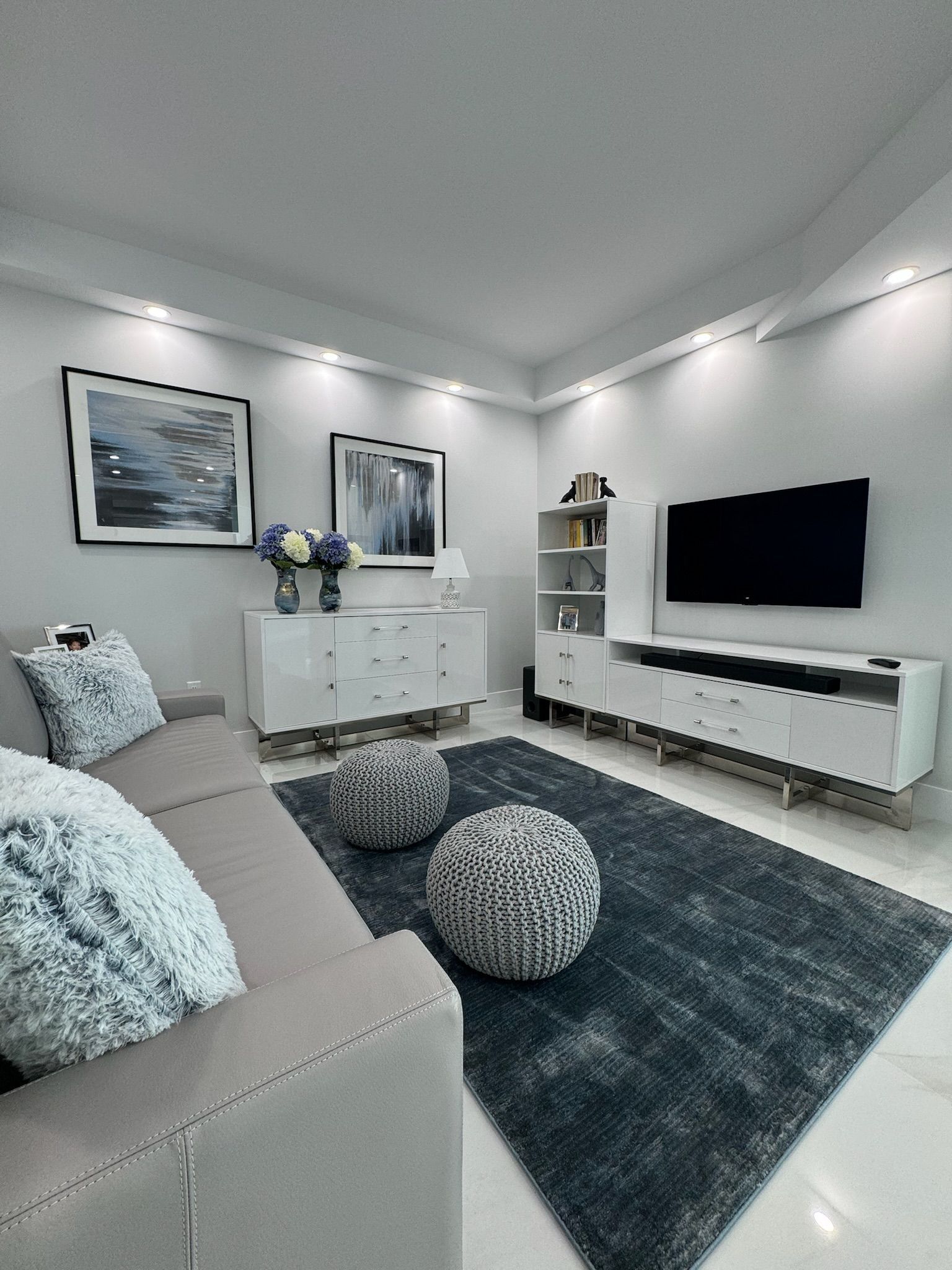 A living room with a couch and a television