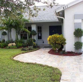 A white house with a walkway leading to it